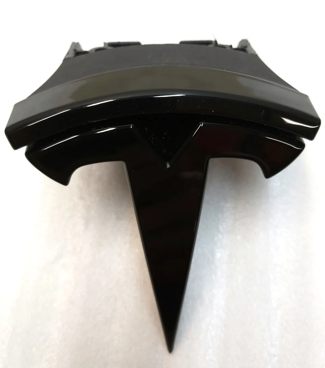 2 T-BADGE, FR FASCIA BLACK Tesla Model S REST 1056386-00-F