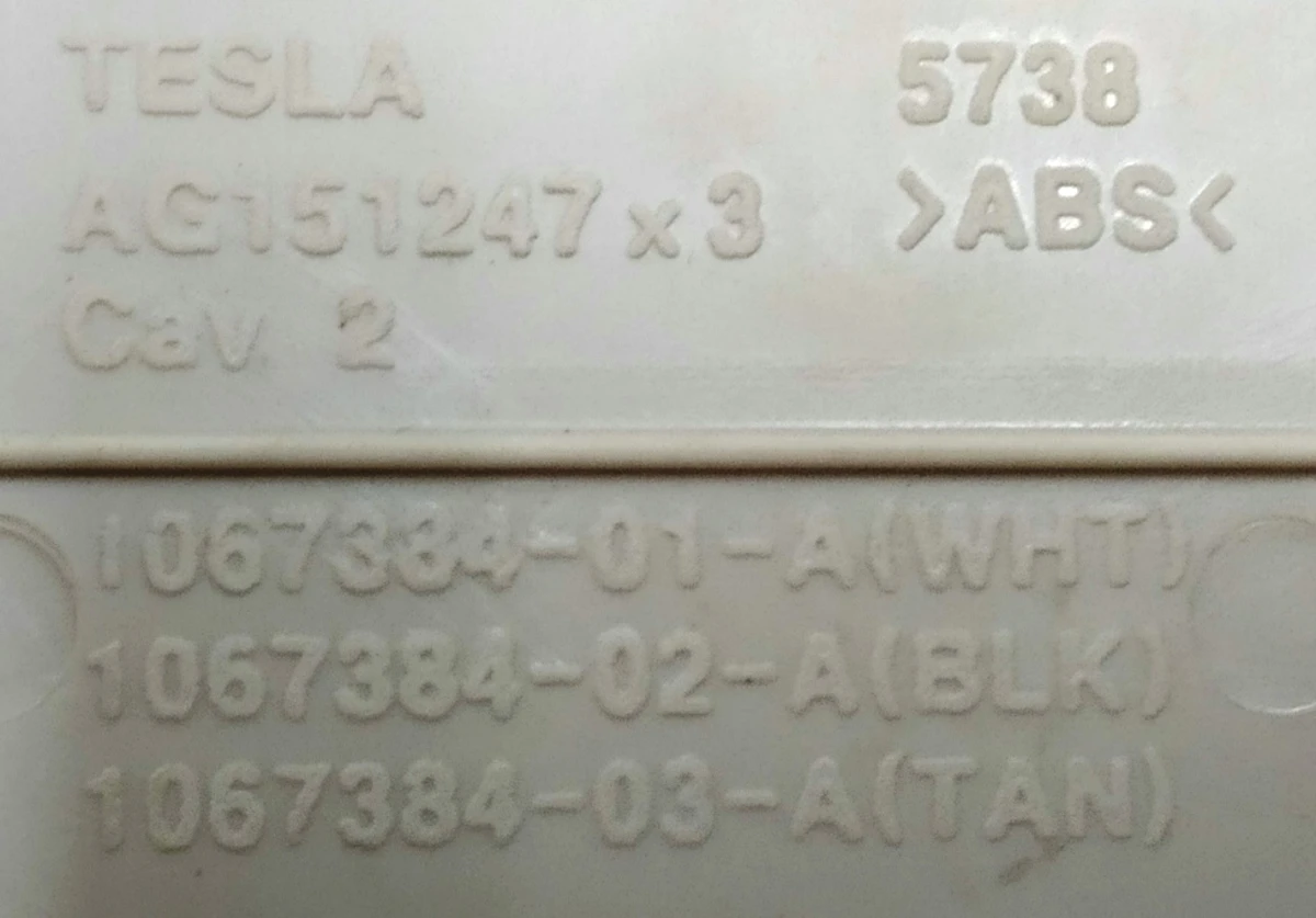 4 Декоративна накладка (пластик) мех. рег. підголівника сидіння 1-го ряду TAN Tesla model S REST, model X 1067384-03-A