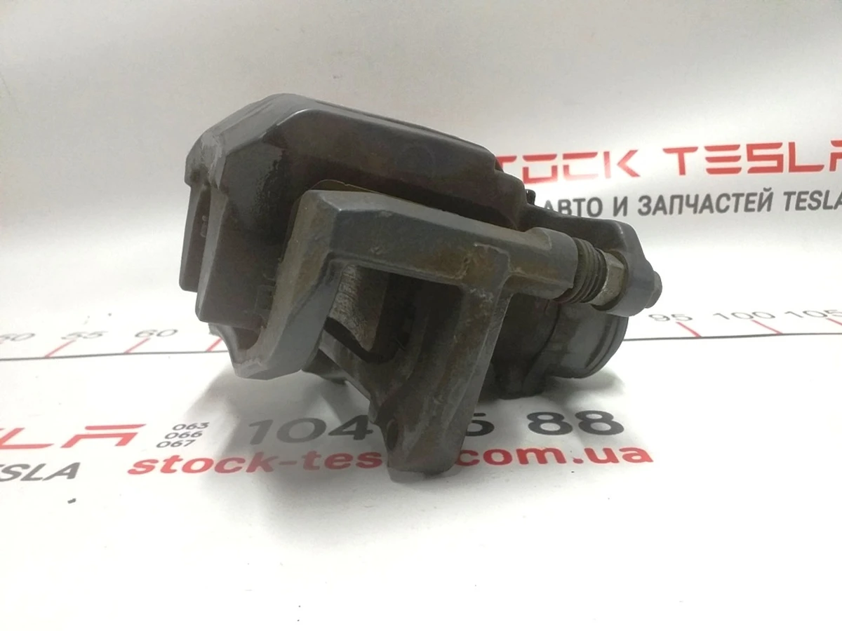 1 Суппорт тормозной задний левый MANDO без накладки TESLA Tesla model S REST, Tesla model X 1078541-00-B