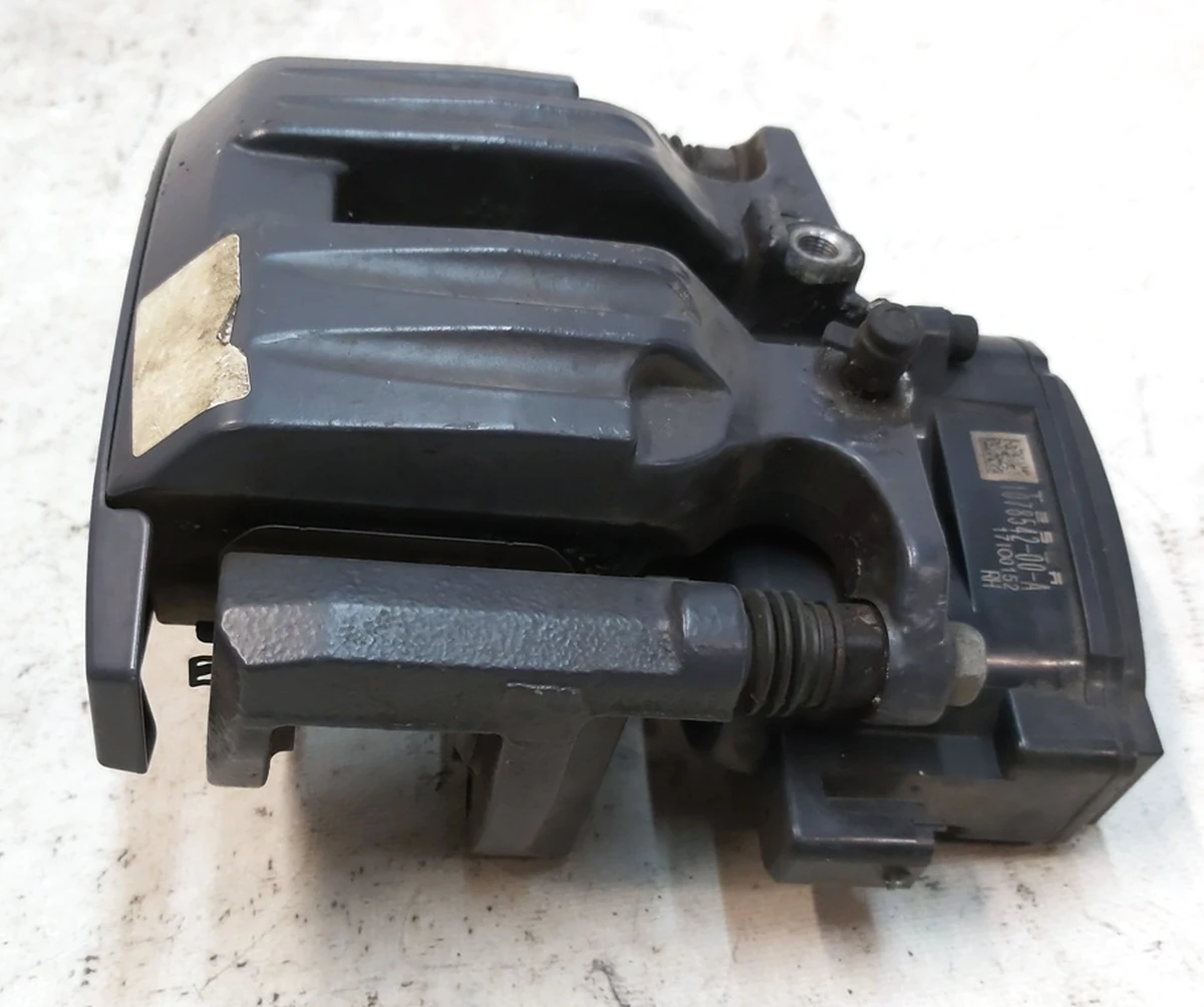 1 Супорт гальмівний задній правий MANDO без гальмівних колодок Tesla model S REST, model X 1078542-00-B