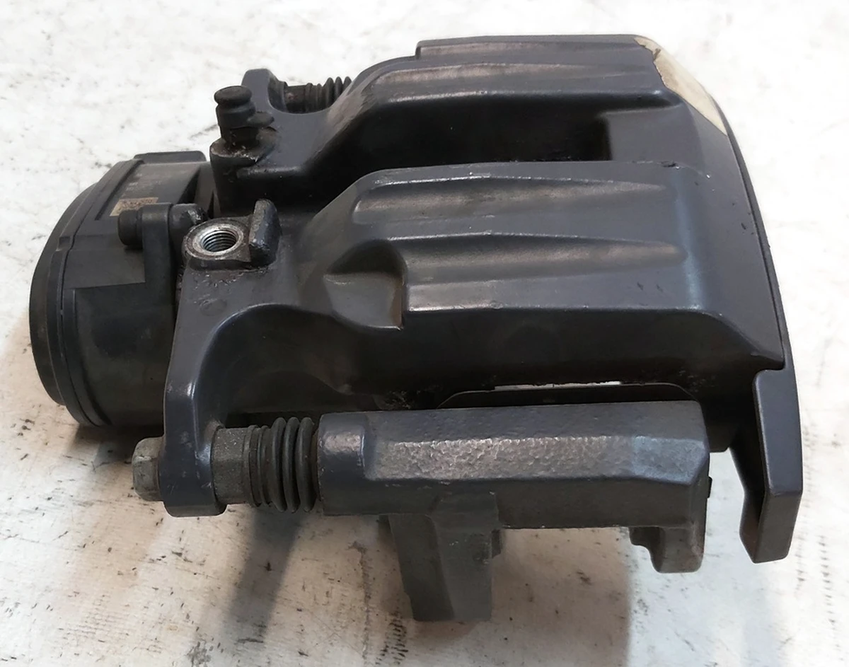 1 Супорт гальмівний задній правий MANDO без гальмівних колодок Tesla model S REST, model X 1078542-00-B