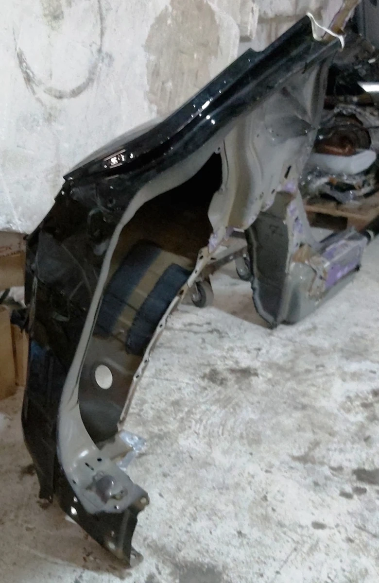 3 Quarter rear left fender with body fragments PBSB Tesla model Y 1549230-S0-A