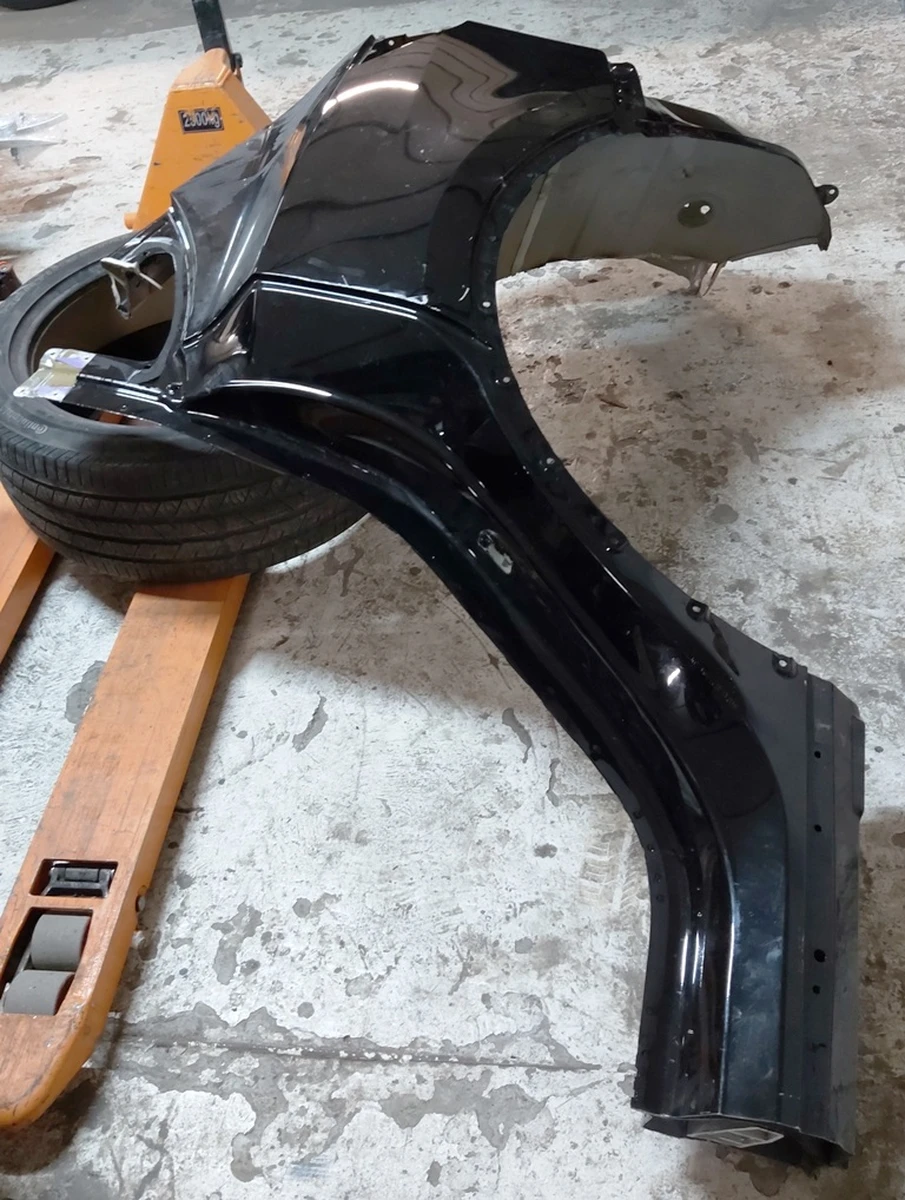 3 Quarter rear left fender with body fragments PBSB Tesla model Y 1549230-S0-A