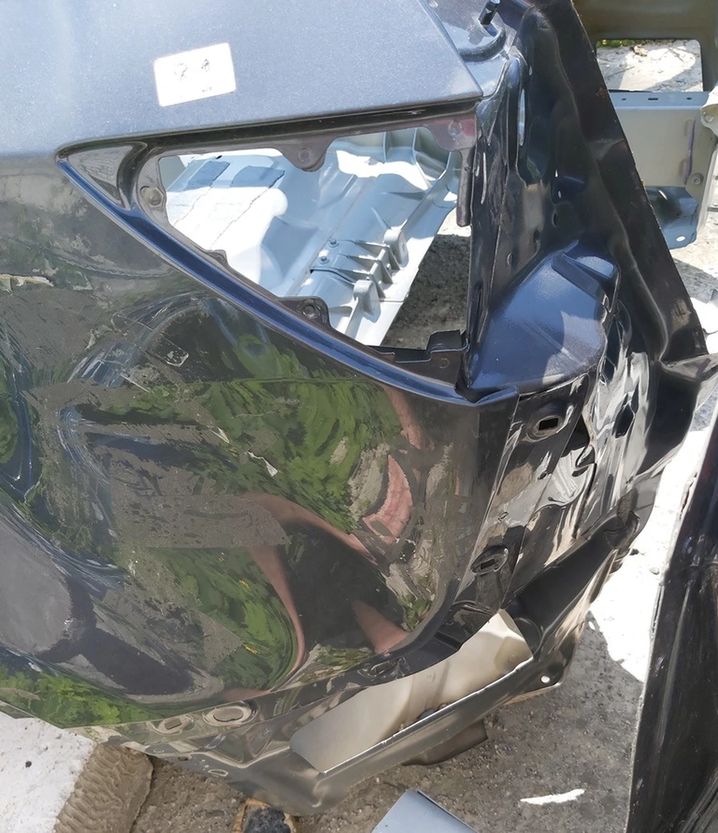 3 Quarter rear left PMNG with damage to wing and spar Tesla model Y 1549230-S0-A