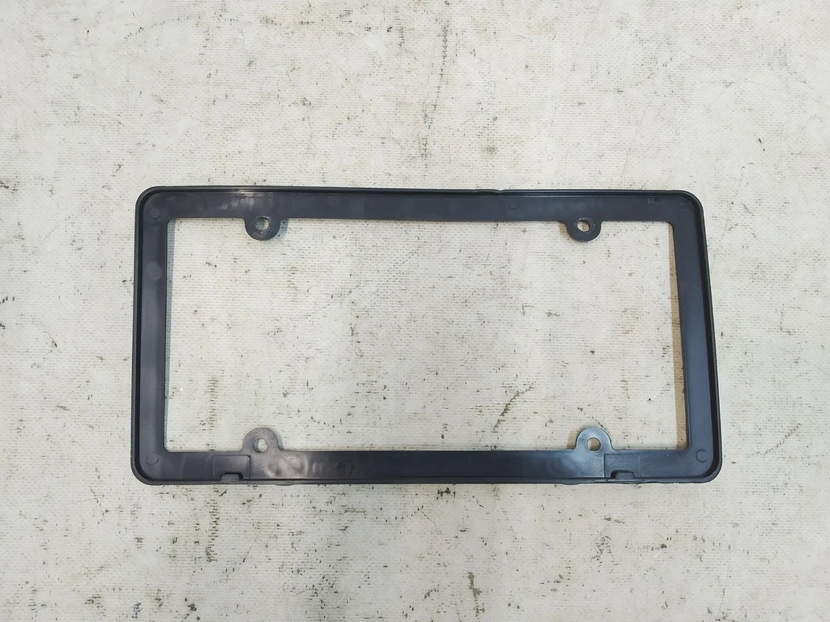 5 Рамка заднього номера (пластик) "EXPERIENCE THE DIFFERENCE" Tesla model Y 1703856-00-A