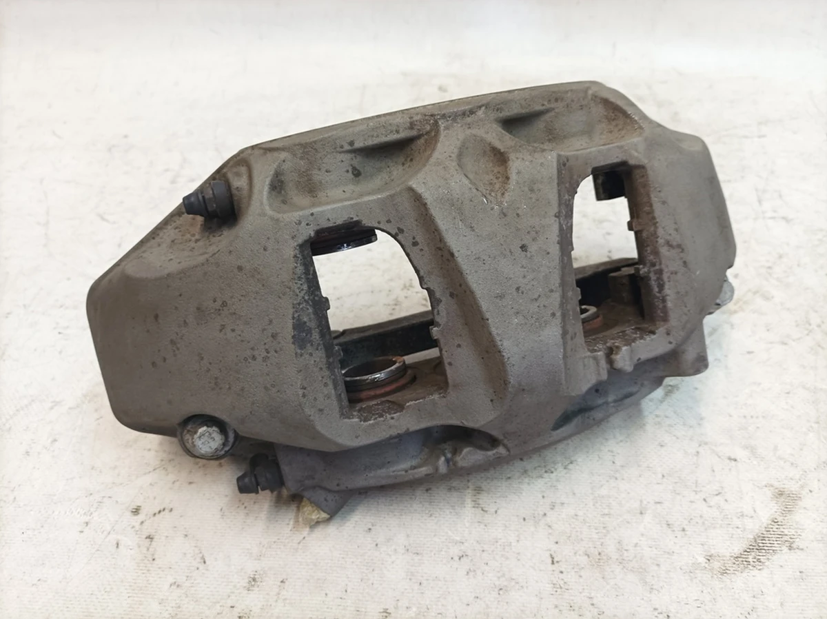 Caliper fixed front right without brake pads with damage Audi Q7 4M0615108H