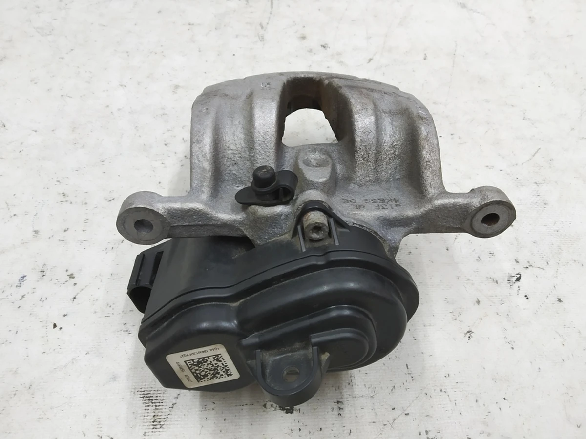 Суппорт тормозной задний левый с исполняющим электродвигателем без колодок Audi E-tron 4M0615403A