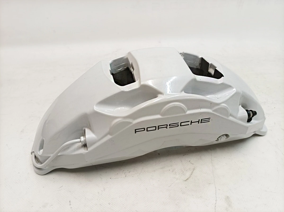 Суппорт неподвижный передний левый без тормозных колодок AKEBONO (Белый 19) Porsche Taycan 9J1615105P