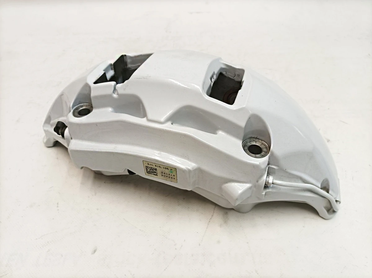 Суппорт неподвижный передний левый без тормозных колодок AKEBONO (Белый 19) Porsche Taycan 9J1615105P